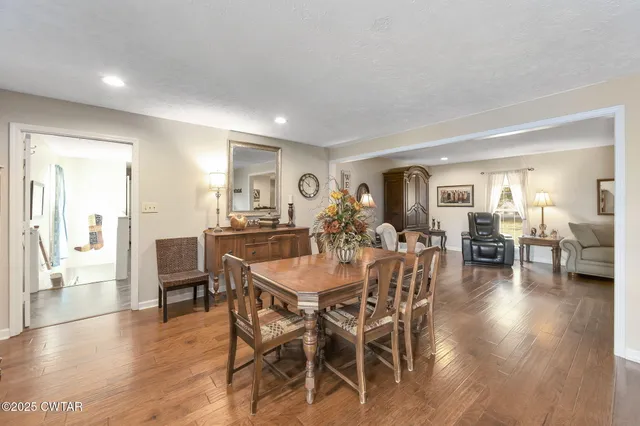 a kitchen with granite countertop stainless steel appliances a refrigerator sink and microwave