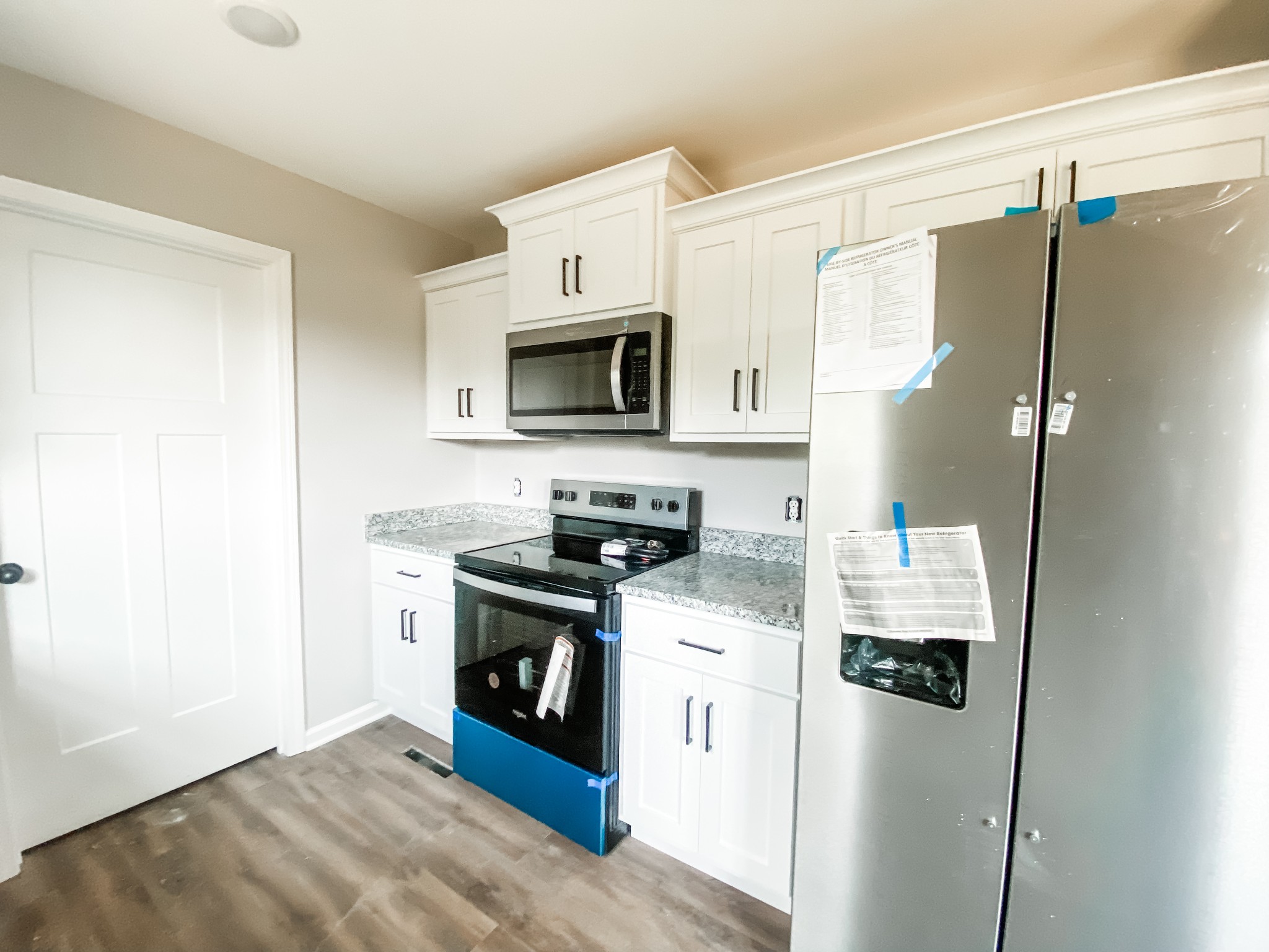 372 Calvert Ridge Road Westmoreland, TN 37186 - Photo 2 of 13 a kitchen with stainless steel appliances a refrigerator stove microwave and sink