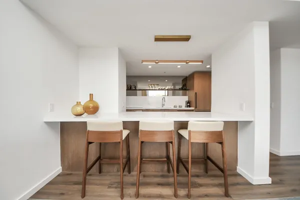 a kitchen with a table and chairs in it