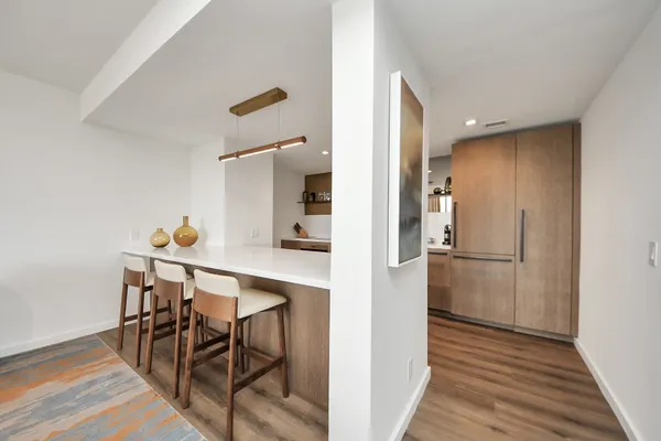 a view of a dining room with furniture and wooden floor