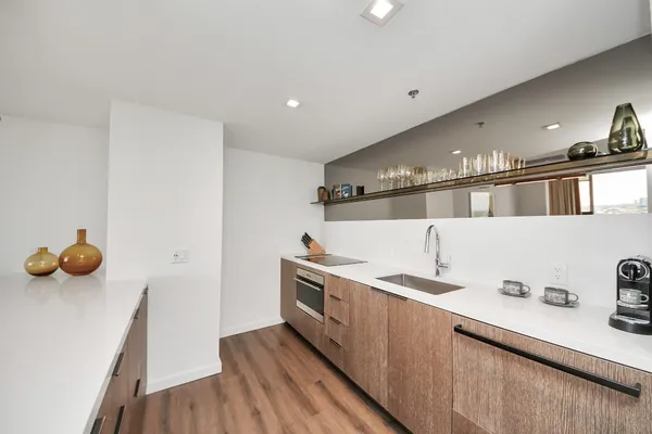 a kitchen with stainless steel appliances a sink and a stove