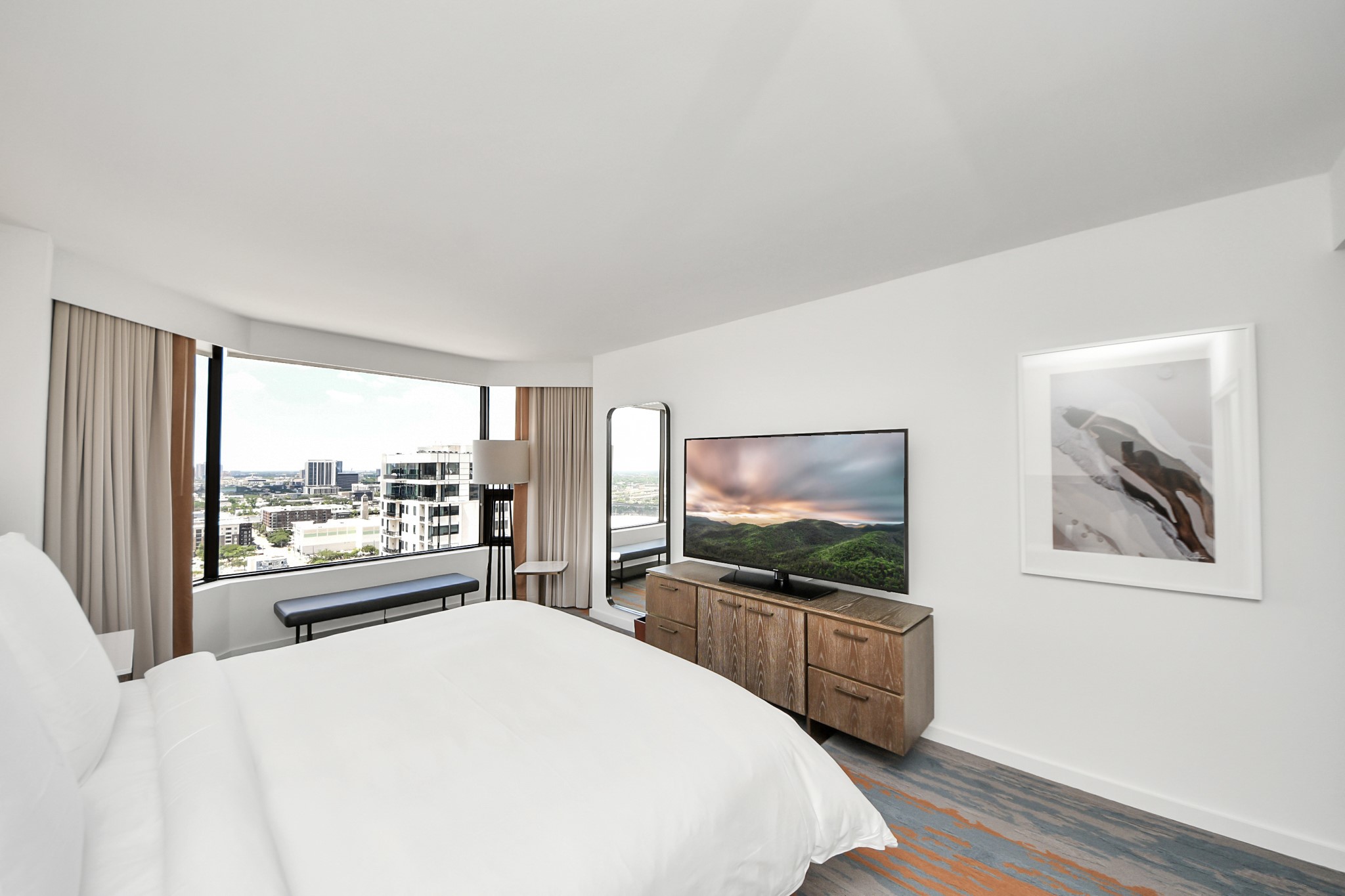 1300 Lamar Street, Unit S8 Houston, TX 77010 - Photo 34 of 50 a bedroom with a bed and a flat screen tv