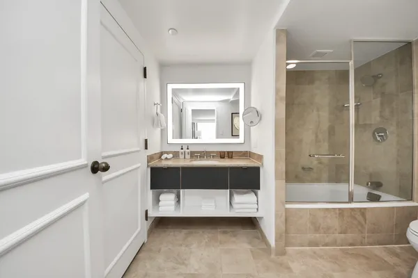 a bathroom with a bathtub and a sink