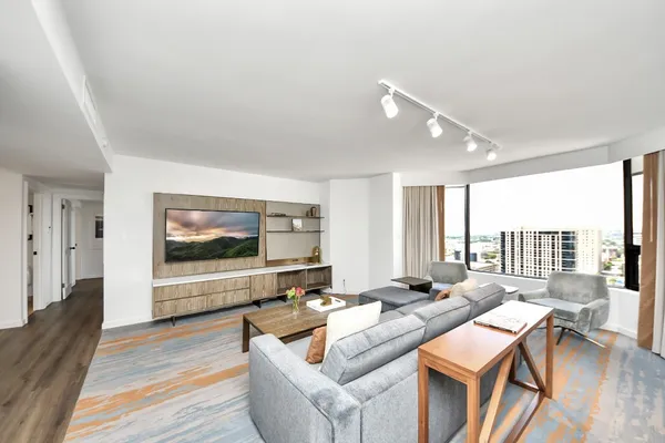a living room with furniture and a flat screen tv