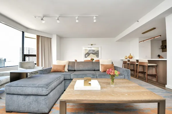 a living room with furniture and a table