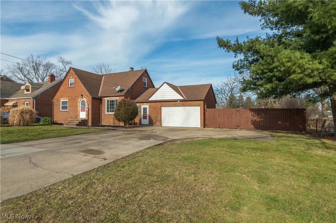 2nd View of All Brick Cape Cod style home w/extra concrete area