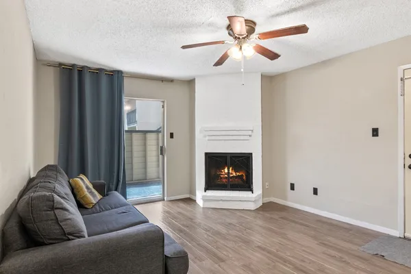a living room with furniture and a fireplace