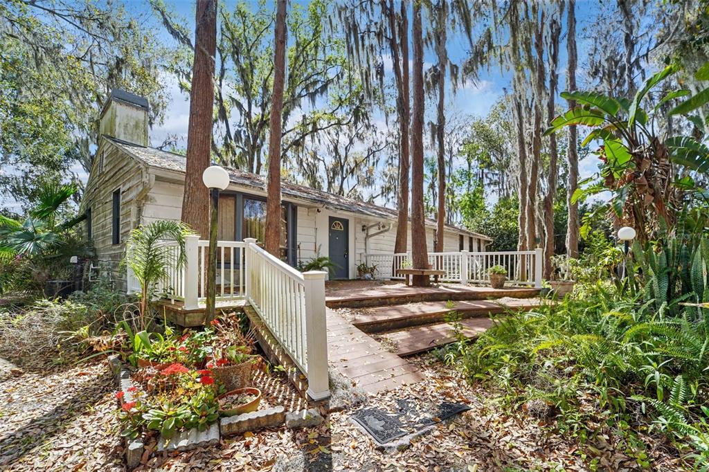 18709 Wayne Road Odessa, FL 33556 - Photo 2 of 34 front view of a house with a small yard