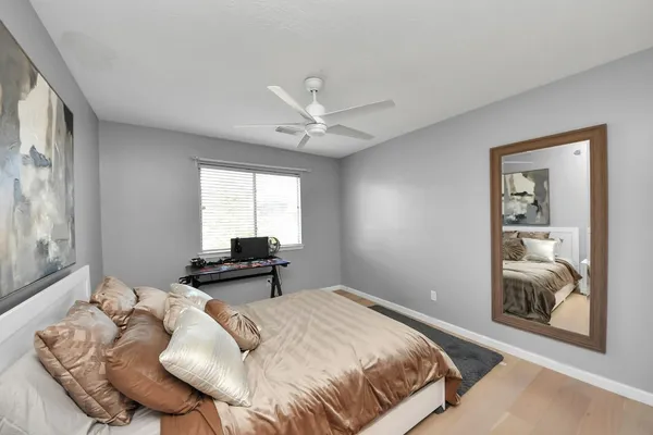 a bedroom with a bed and window
