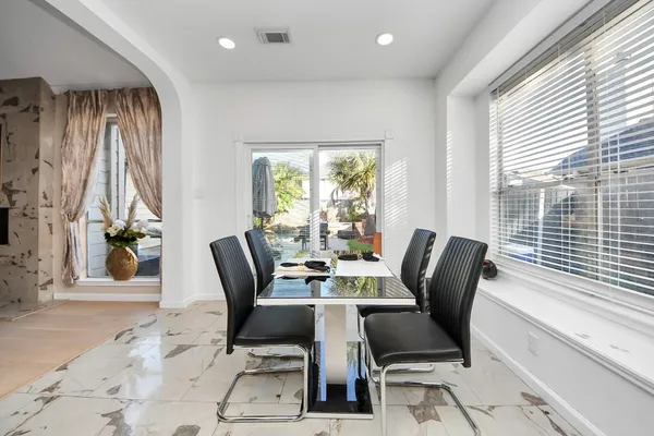 a view of a dining room with furniture window and outside view
