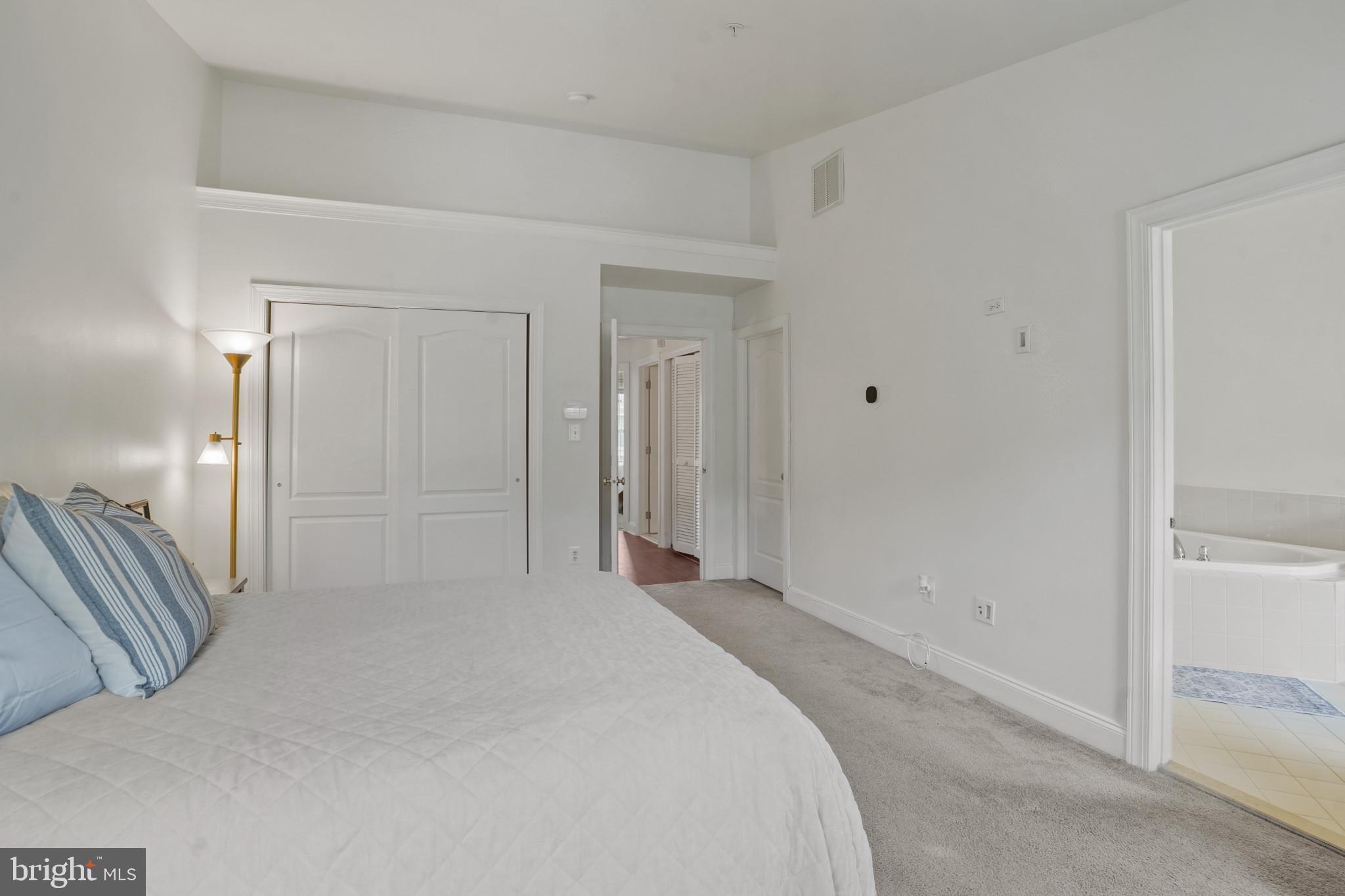 7609 Elmcrest Road Hanover, MD 21076 - Photo 17 of 37 a bedroom with a bed and a shower
