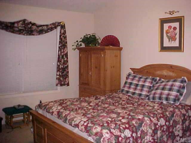 1129 Pilton Place Raleigh, NC 27604 - Photo 7 of 9 Master bd. has cathedral ceiling, dual vanities, garden tub.