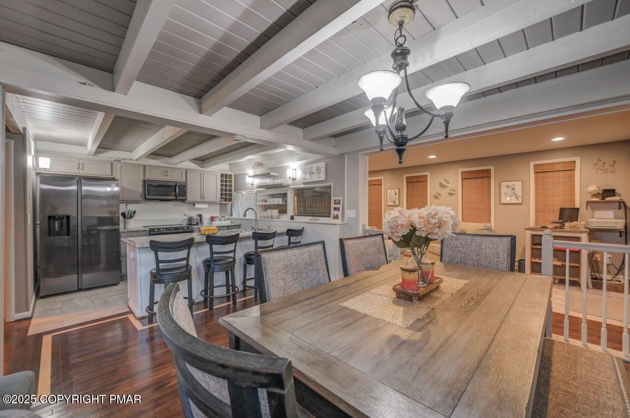 437 Westcolang Road Hawley, PA 18428 - Photo 13 of 108 a view of a dining room with furniture window and wooden floor