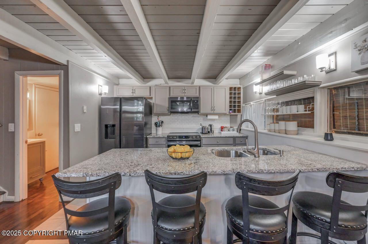 437 Westcolang Road Hawley, PA 18428 - Photo 15 of 108 a kitchen with a dining table and chairs
