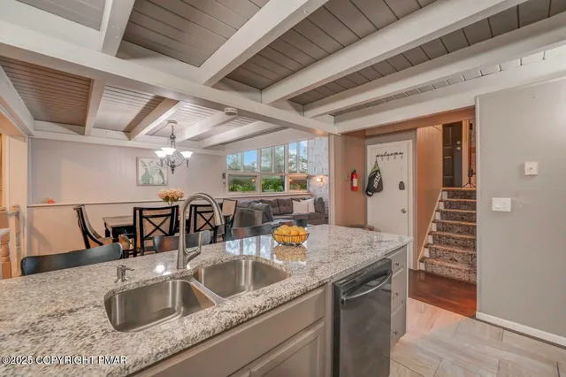 a backyard of a house with barbeque oven