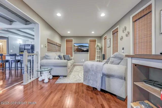 a living room with a couch and a large window