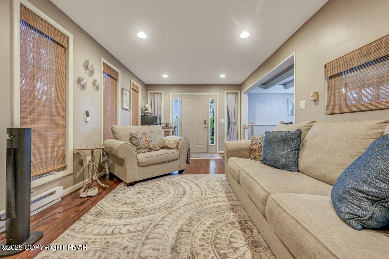 437 Westcolang Road Hawley, PA 18428 - Photo 4 of 108 a living room with a couch and a large window