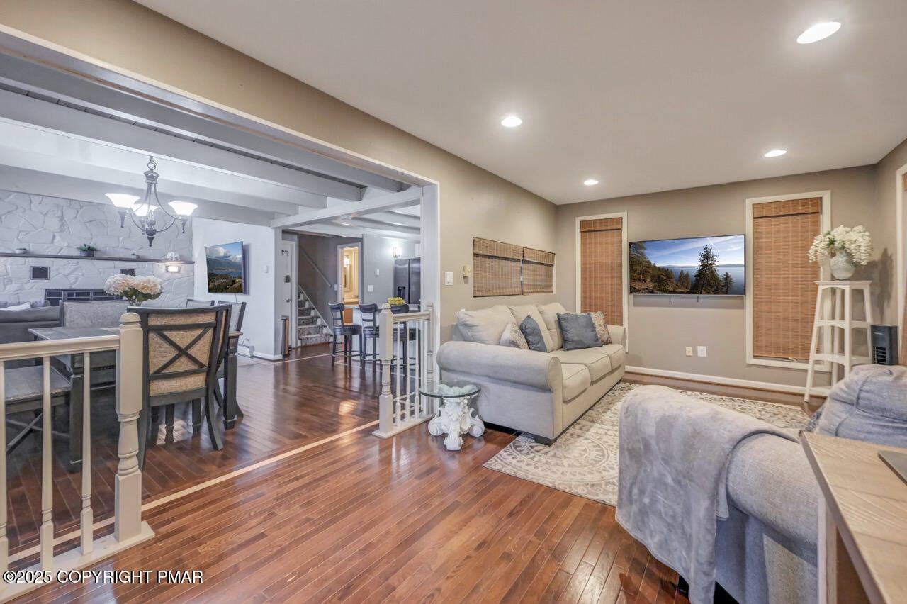 437 Westcolang Road Hawley, PA 18428 - Photo 6 of 108 a living room with furniture and a wooden floor