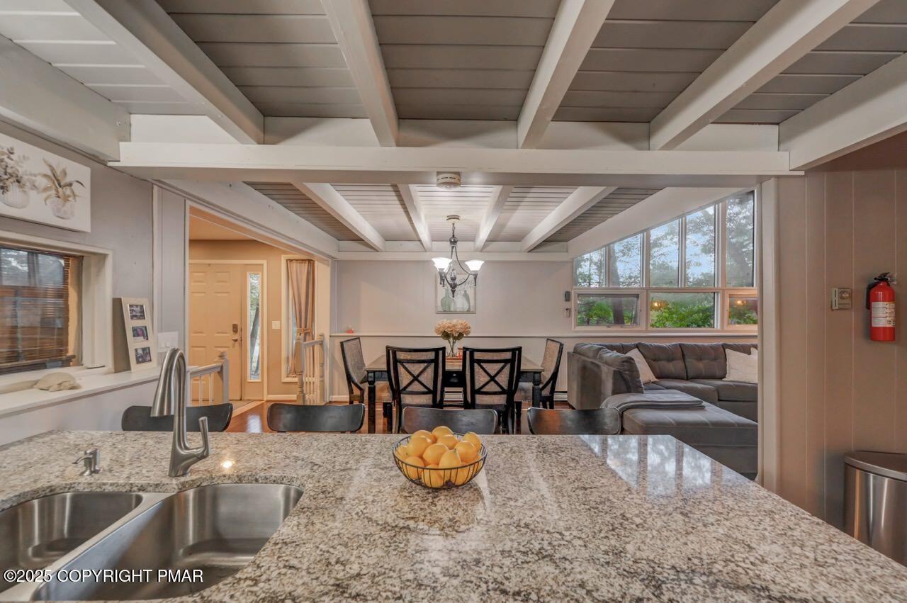 437 Westcolang Road Hawley, PA 18428 - Photo 57 of 108 a kitchen with stainless steel appliances granite countertop a stove a sink and a granite counter tops with garden view