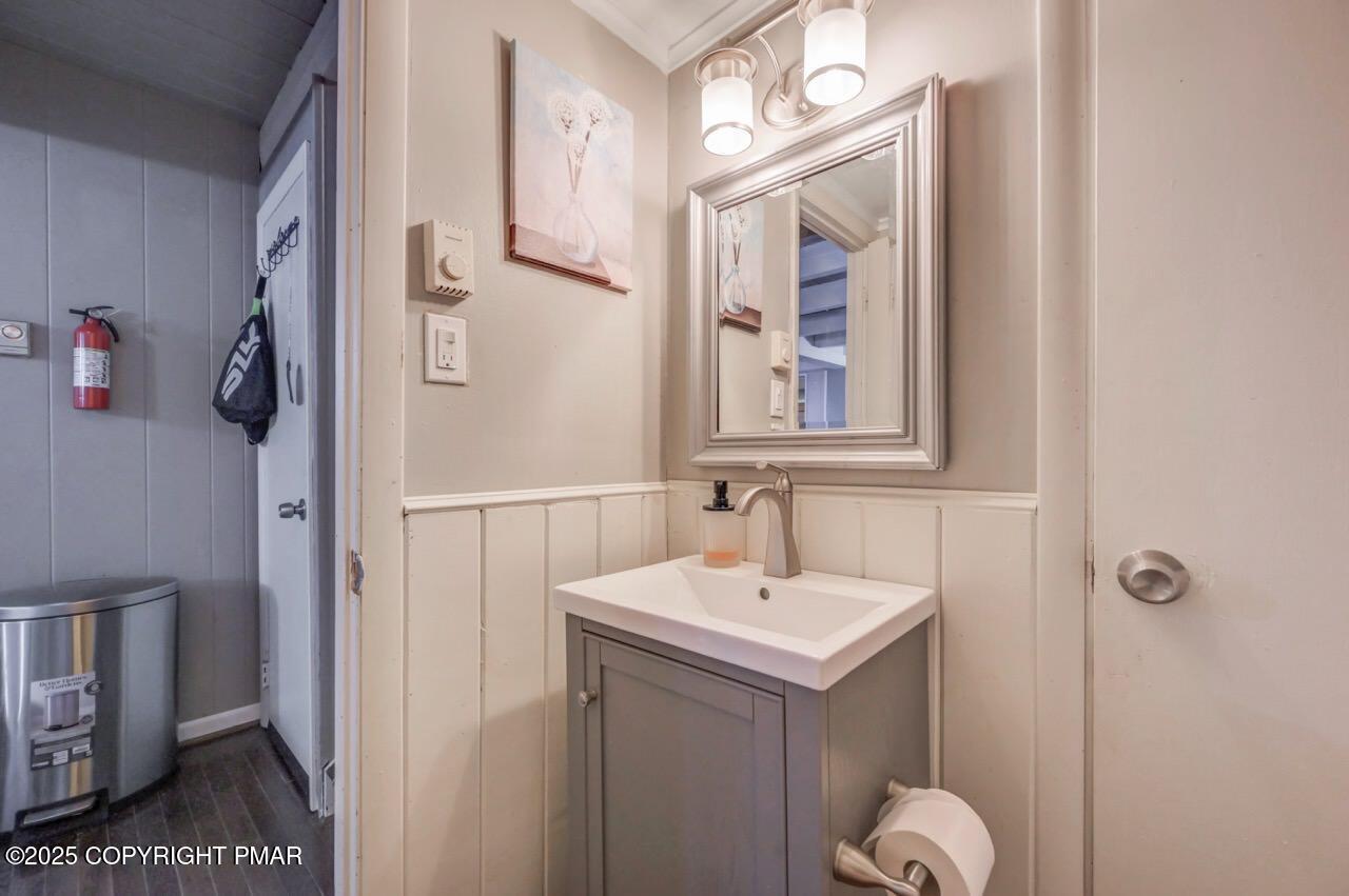 437 Westcolang Road Hawley, PA 18428 - Photo 59 of 108 a bathroom with a sink and a mirror