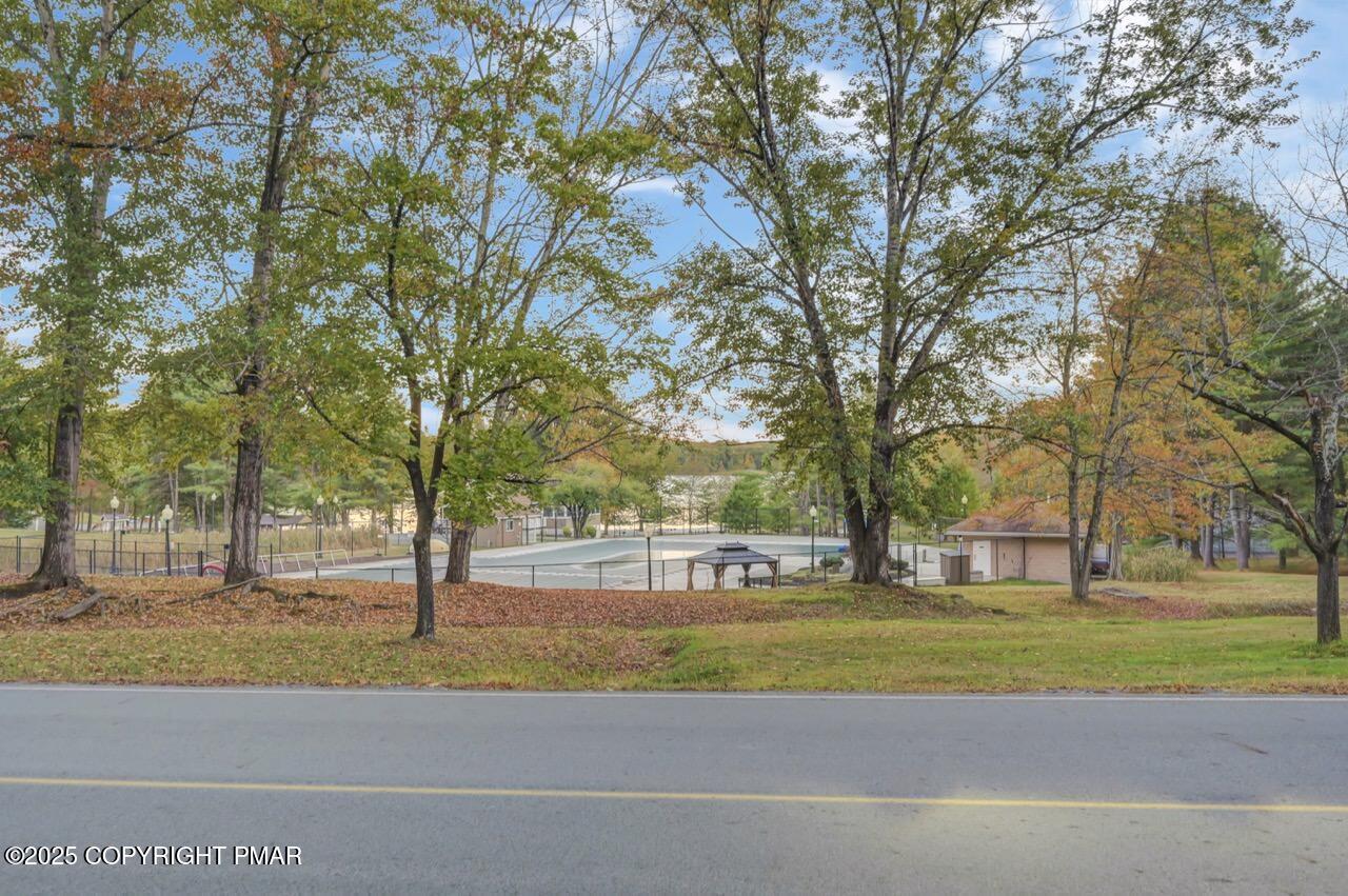 437 Westcolang Road Hawley, PA 18428 - Photo 79 of 108 a view of a house with a big yard and large trees