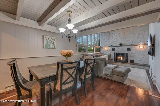a kitchen with a dining table and chairs