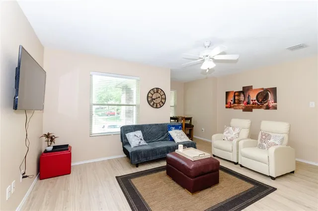 a view of a dining room with furniture and window