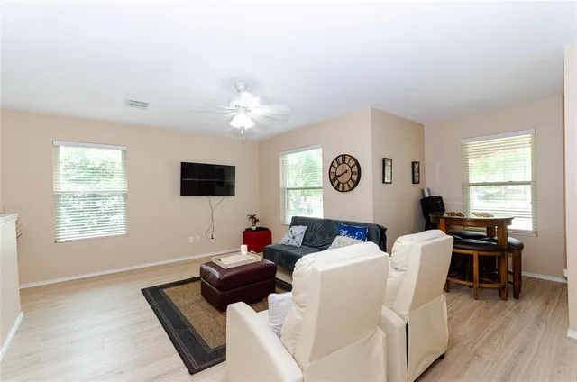 a view of a dining room with furniture and window