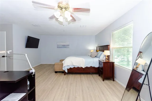 a bedroom with a bed and a table