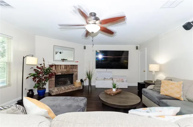 a kitchen with granite countertop a sink stove and refrigerator