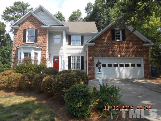 5404 Calverton Drive Raleigh, NC 27613 - Photo 1 of 25 a front view of a house with a garden