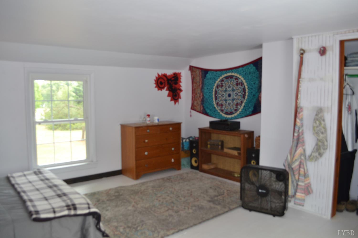 6387 Red House Road Rustburg, VA 24588 - Photo 28 of 38 a bedroom with a bed and a window