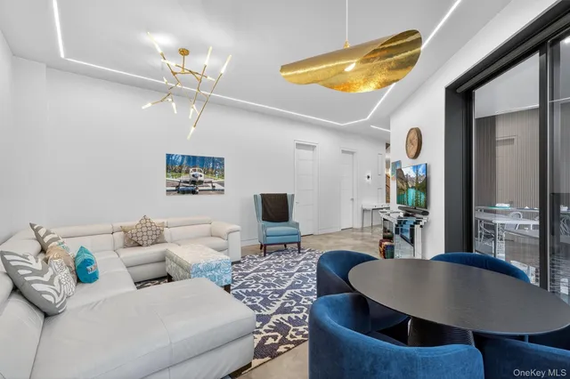 a vase of flowers sitting on a dining table with chairs
