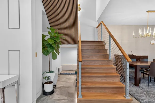 a spacious bedroom with a large bed and a large window