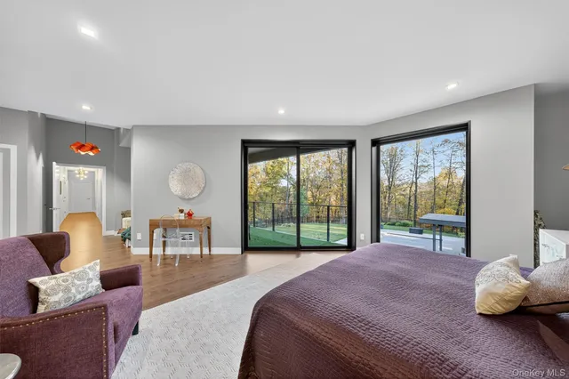 a bed room with a bed and a large window