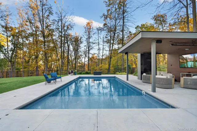 a view of patio with chairs and tables