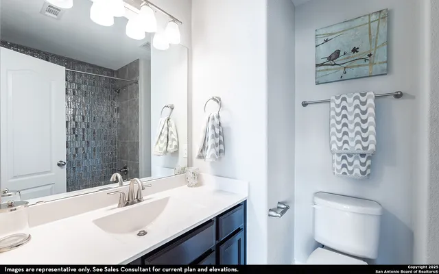 a bedroom with a bed and a couch next to a window