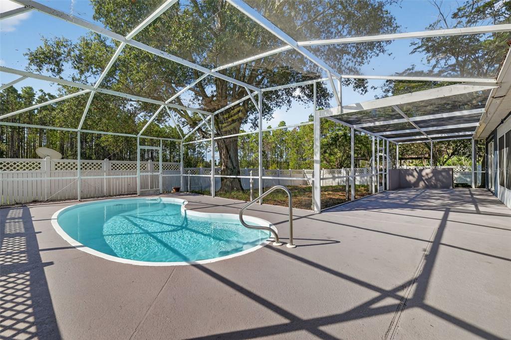 14520 Lost Lake Road Clermont, FL 34711 - Photo 26 of 47 a view of a house with backyard and sitting area
