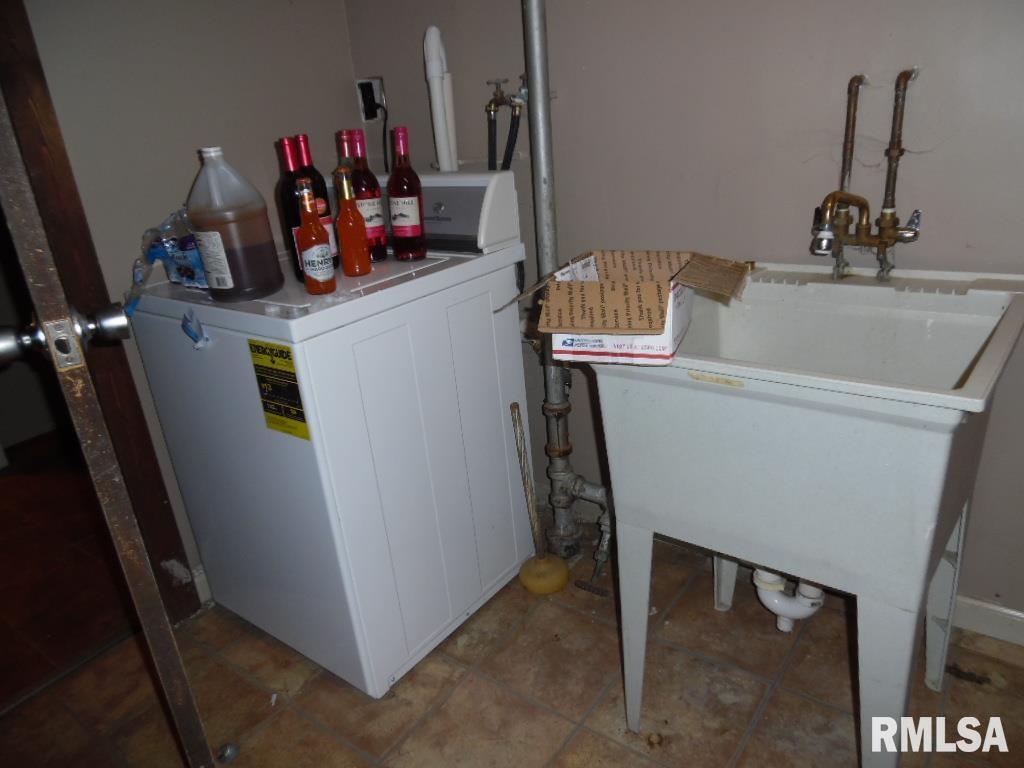 1620 North 3rd Street Clinton, IA 52732 - Photo 16 of 20 a room with storage and utility