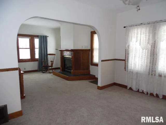 a kitchen with cabinets appliances and a window