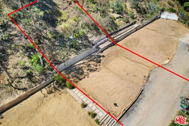 a view of a backyard with trees