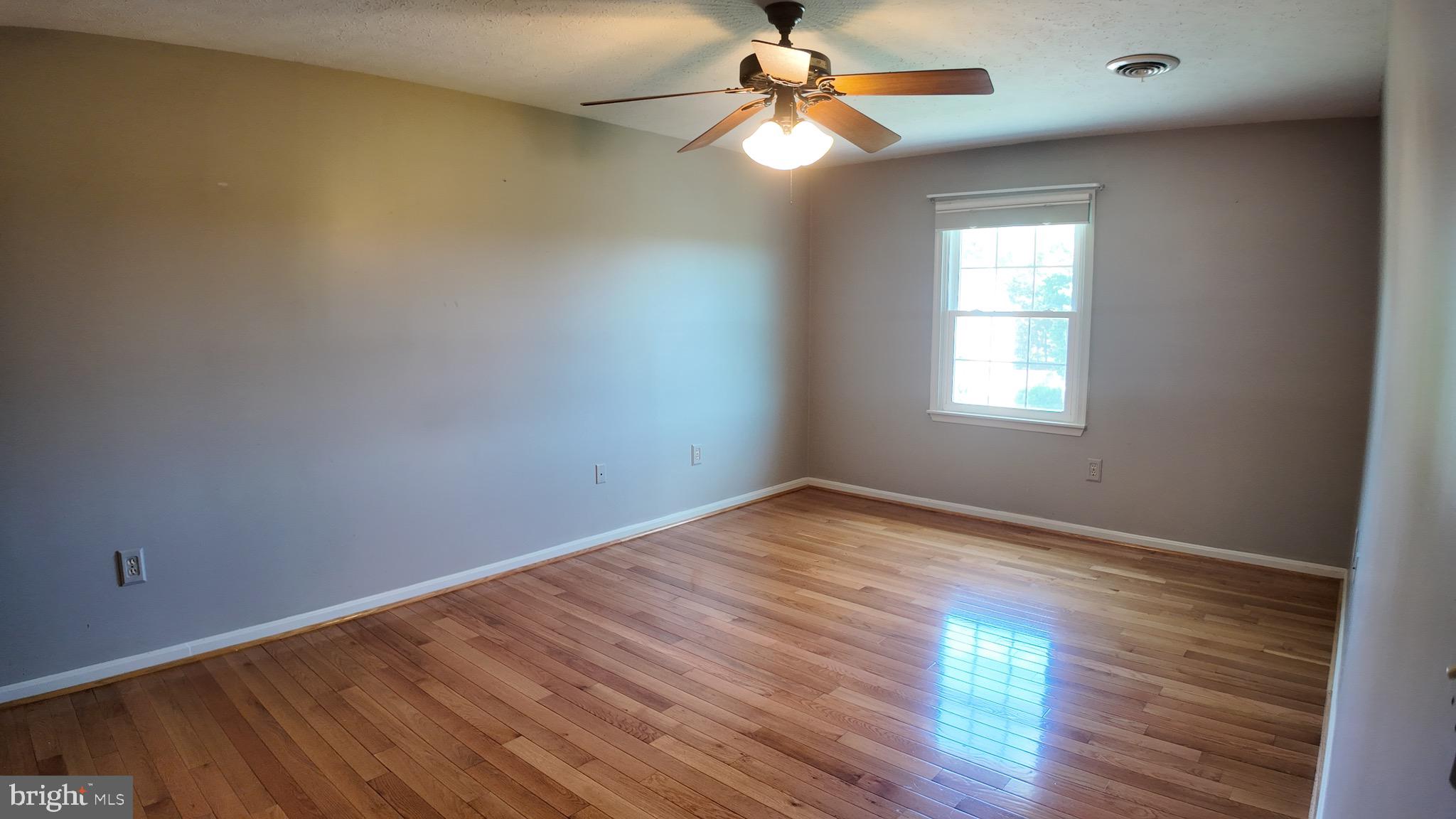 1185 Kesler Road Front Royal, VA 22630 - Photo 26 of 51 wooden floor in an empty room with a window