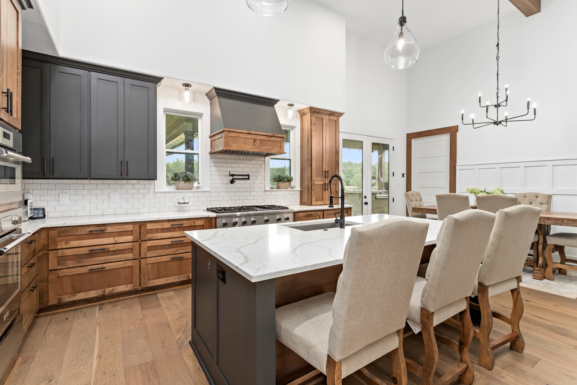 10573 Cooks Lake Road Lumberton, TX 77657 - Photo 11 of 47 a kitchen with a table chairs sink and cabinets