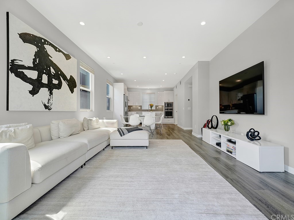 604 Malibu Costa Mesa, CA 92627 - Photo 15 of 40 a living room with furniture and a flat screen tv