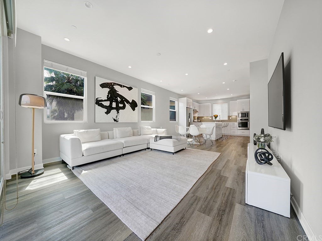 604 Malibu Costa Mesa, CA 92627 - Photo 16 of 40 a living room with furniture and a flat screen tv