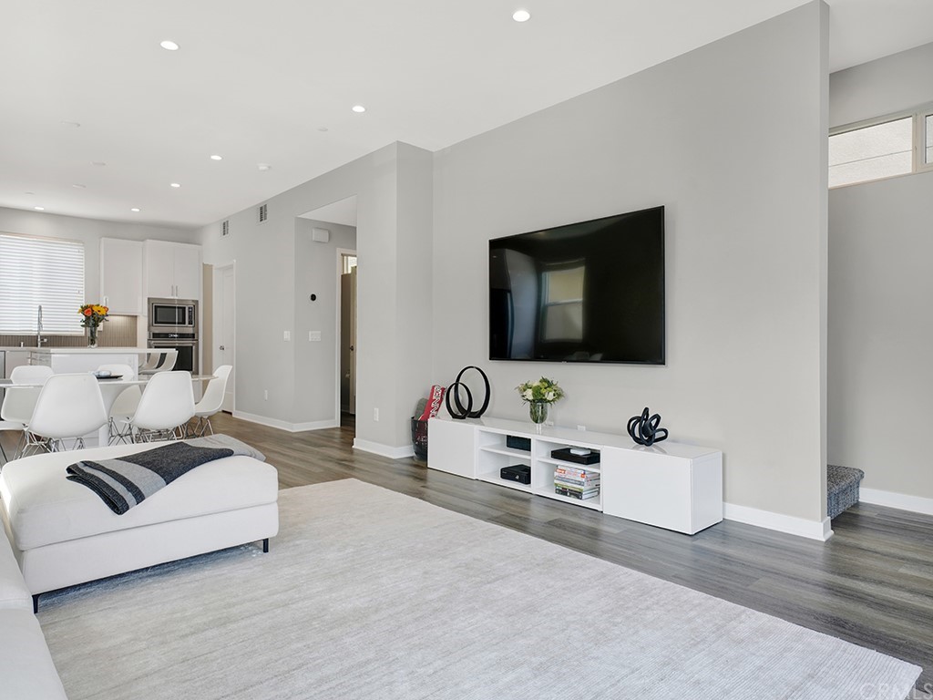 604 Malibu Costa Mesa, CA 92627 - Photo 17 of 40 a living room with furniture and a flat screen tv