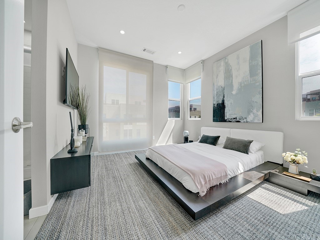 604 Malibu Costa Mesa, CA 92627 - Photo 24 of 40 a bedroom with a bed and wooden floor