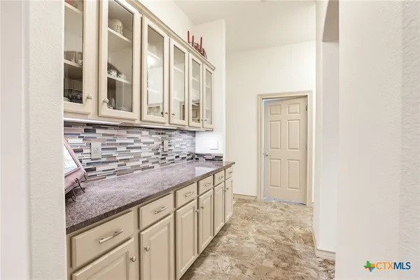 a kitchen with stainless steel appliances granite countertop a stove and a sink