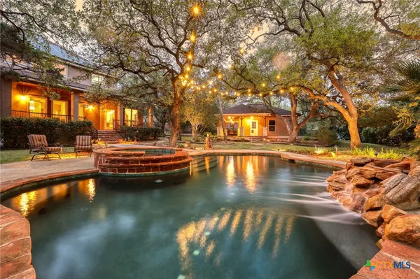 a view of swimming pool with outdoor seating
