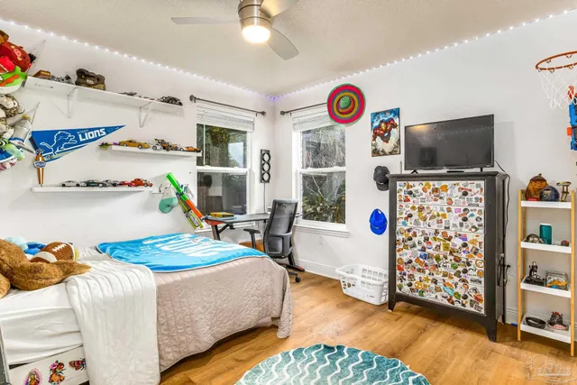 a bedroom with bed and a window